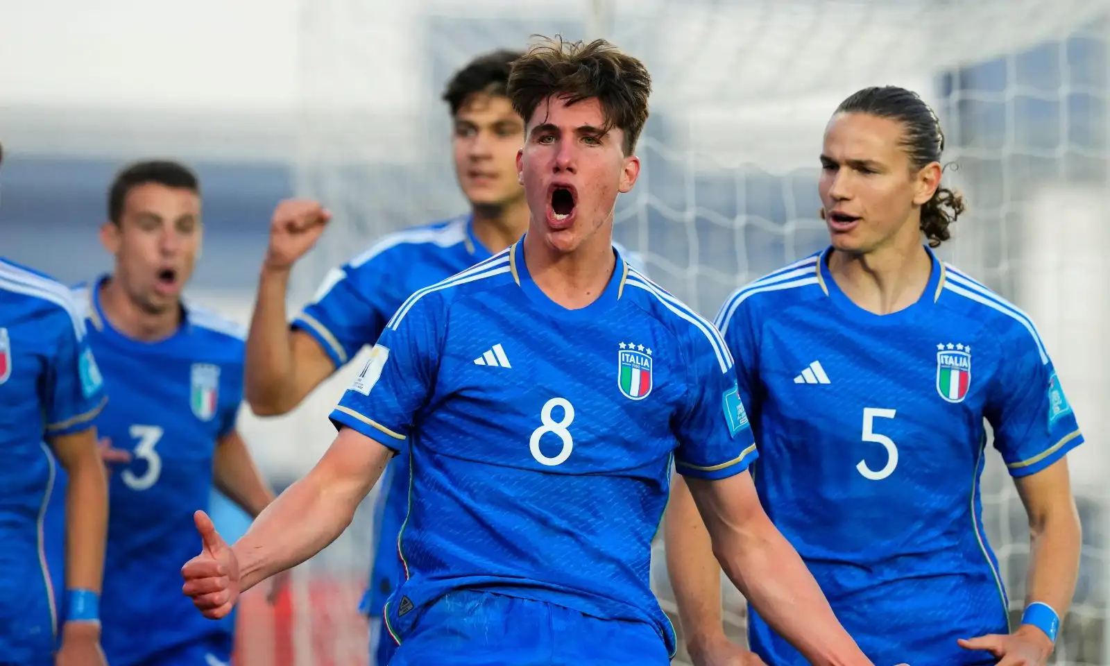 Italy's Cesare Casadei, center, celebrates with teammates after scoring his side's opening goal against Colombia during a FIFA U-20 World Cup quarterfinal soccer match at the Bicentenario stadium in San Juan, Argentina, Saturday, June 3, 2023.