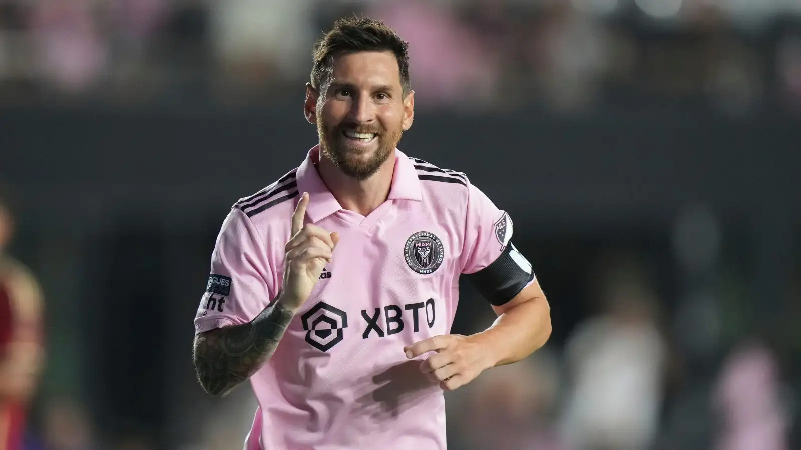 Inter Miami midfielder Lionel Messi (10) gives the #1 sign after assisting.a goal in the second half during the Leagues Cup match between Atlanta United and Inter Miami