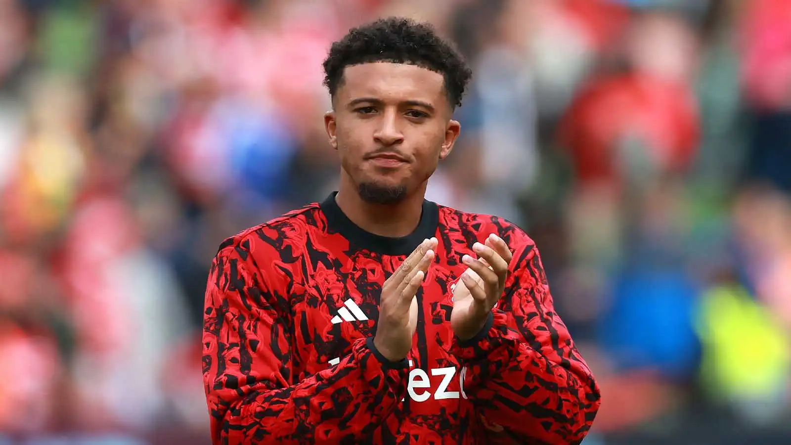 Jadon Sancho applauds the fans