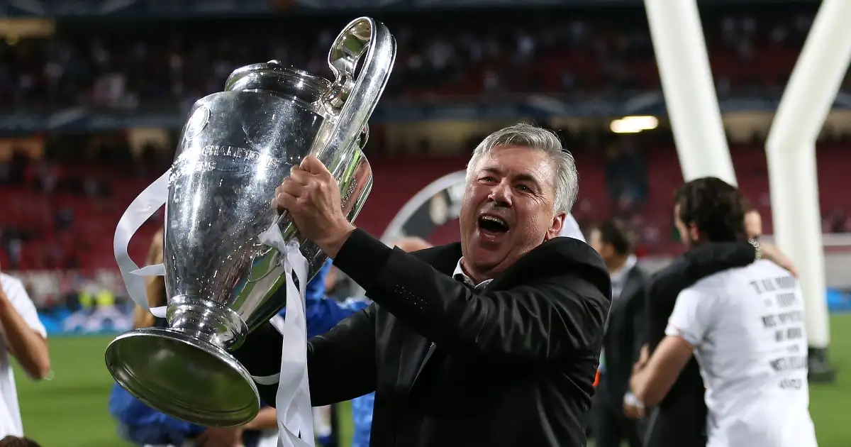 Carlo Ancelotti celebrates with the Champions League trophy after beating Atletico in the final at the Estadio da Luz, Lison, Portugal. May 24, 2014.