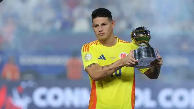 James Rodriguez receives his MVP award for Colombia at the Copa America.