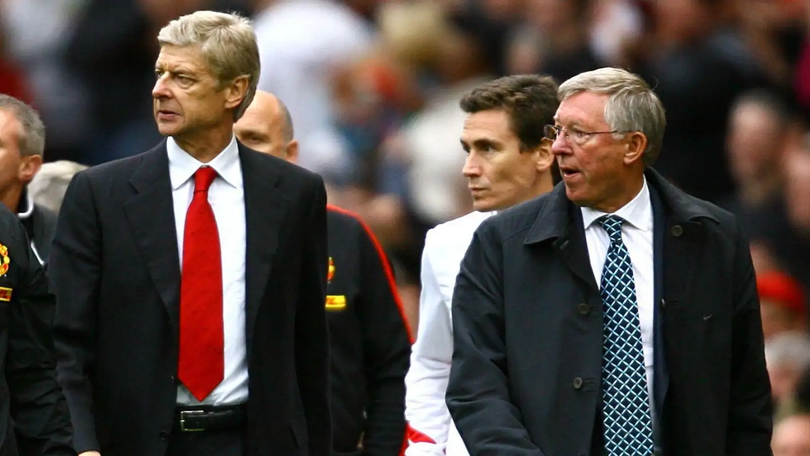 Arsene Wenger and Sir Alex Ferguson leave the field after the Premier League match between Manchester United and Arsenal at Old Trafford, Manchester, August 2009.