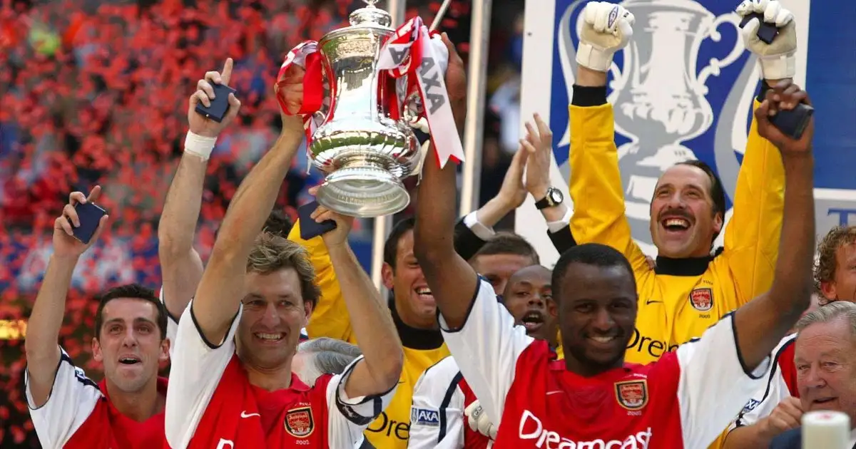 Patrick Vieira and Tony Adams of Arsenal lif the Premier League trophy at Highbury, London, May 5 2022.