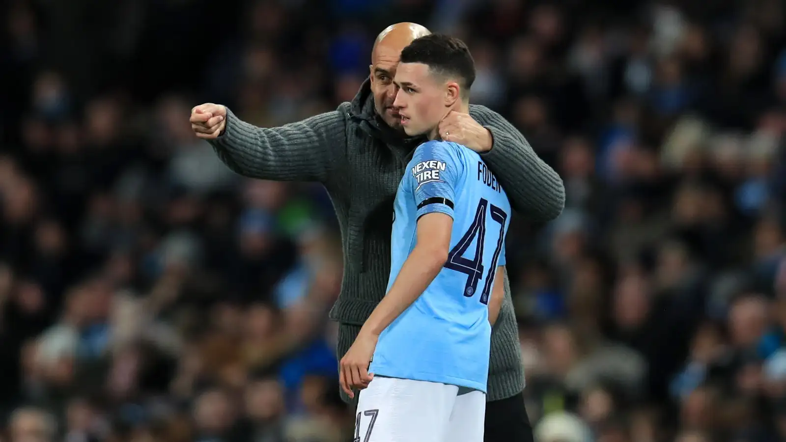 Manchester City manager Pep Guardiola speaks to Phil Foden during the Carabao Cup, Fourth Round match at the Etihad Stadium, Manchester.