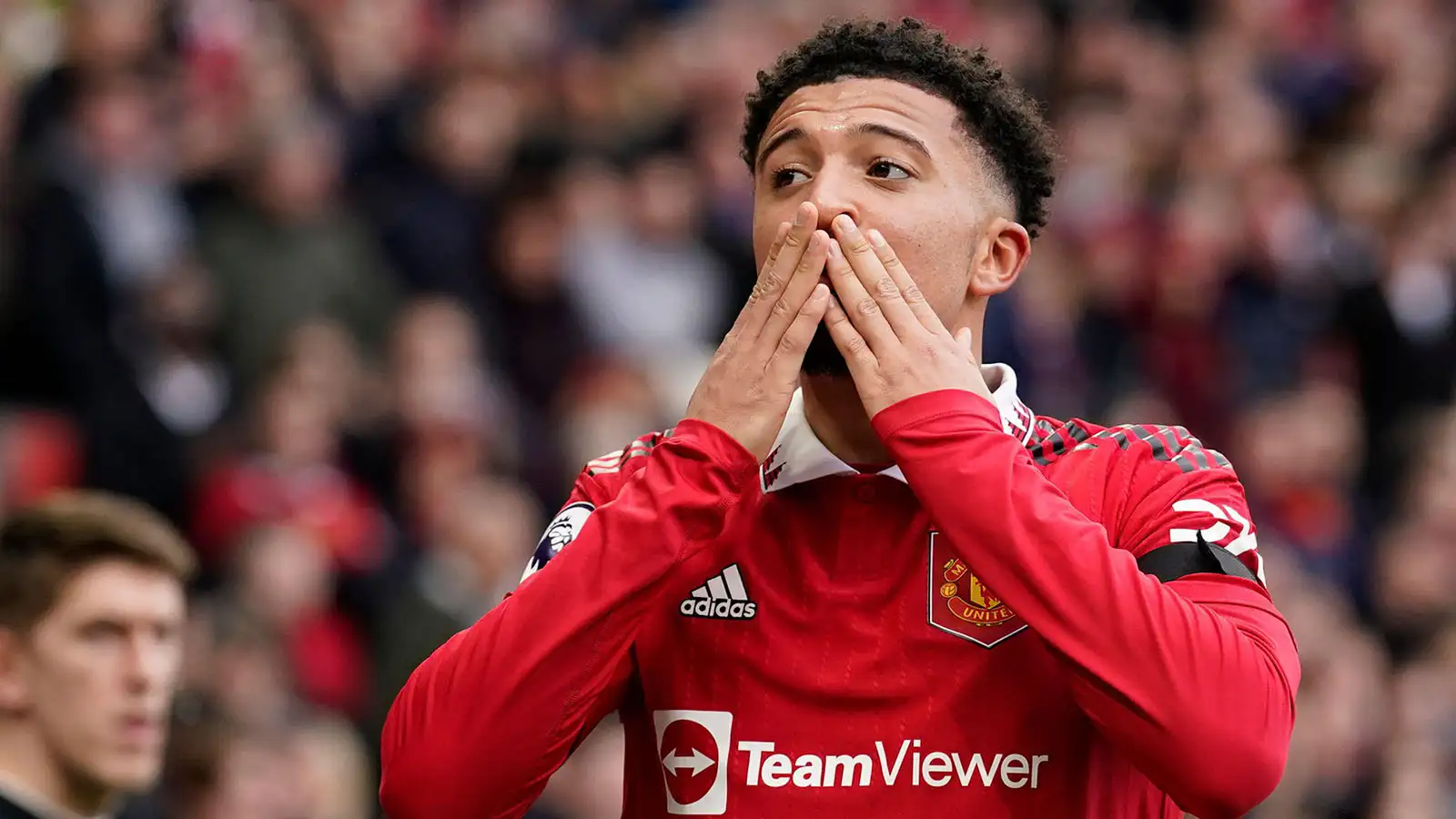 Manchester United's Jadon Sancho celebrates after scoring his side's third goal during the English Premier League soccer match between Manchester United and Leicester City at the Stamford Bridge stadium in Manchester, England, Sunday, Feb. 19, 2023.